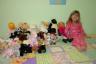 Julia and all her stuffed animals that MUST be on her bed! (and Katie too)