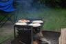 our pizzas cooking on the fire