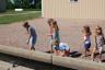 the kids went to the fish hatchery to feed the trout