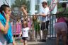 Callie and Scott standing in line to ride her first big rollercoaster - Julia wished them good luck