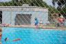 Julia jumping off the diving board at swimming lessons