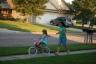 Julia learning how to ride her bike without training wheels