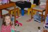 The girls playing in the big barbie house