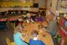 Julia is making scratch ornaments - notice the nicely wrapped desks done by Mommy!