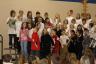 The 4th graders also sang songs as a group