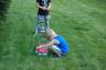 Jace is getting the lawn mower started 