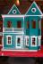 We put on the porch trim as well (teal strips on the white porch)