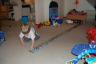 Since it was an alphabet train he decided he should push it around like a train