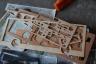 We had to pop out all the parts, sand, paint, and glue them together