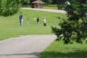 Daddy, Callie, and Andrew frisbee golfing
