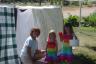 Look at the cool fort Grandma made us on her clothesline!